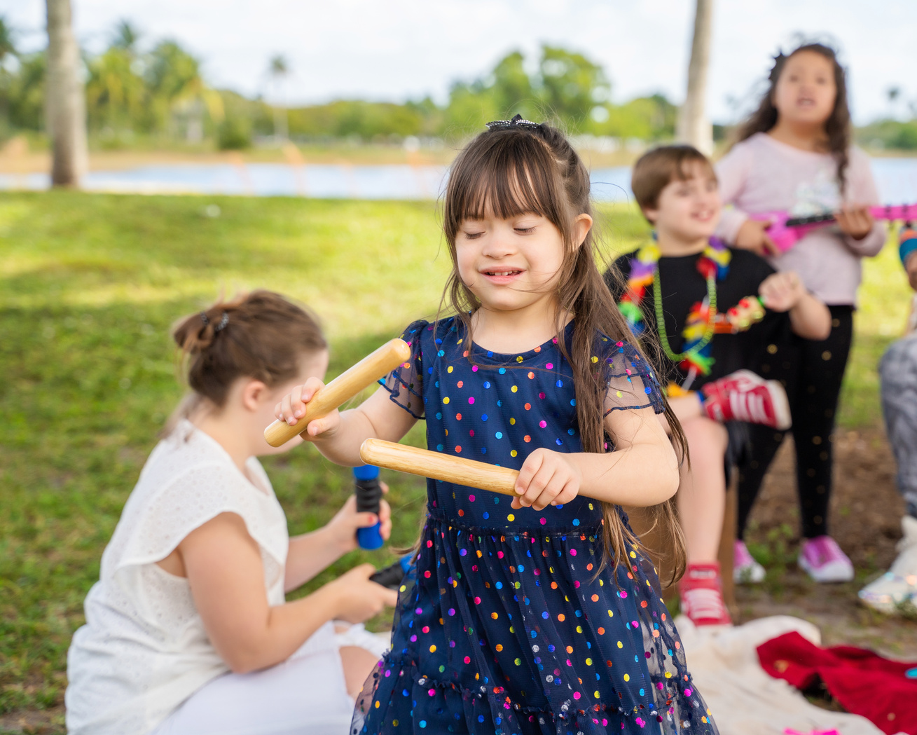 Kids playing with music instruments at a park